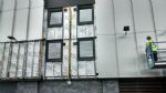 Cladding being taken down on Whitebeam Court